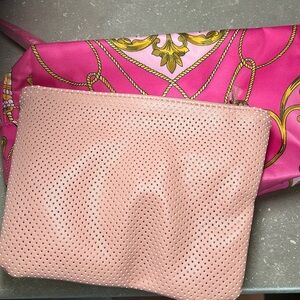 Two pink pouches - 1 pale pink and 1 dark pink with tassels